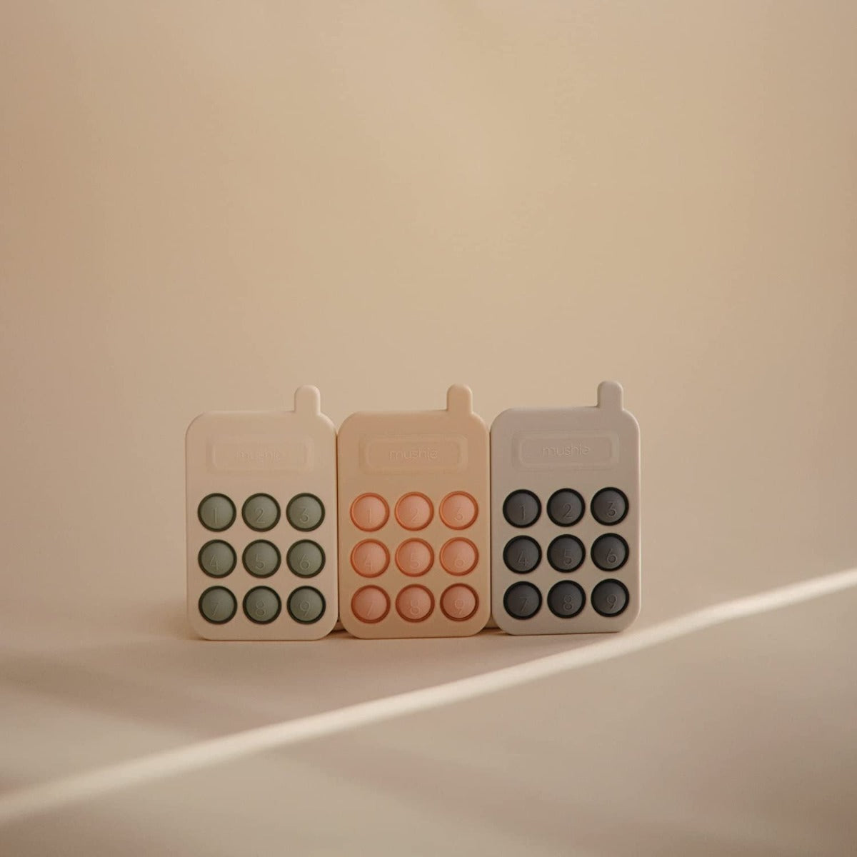 Mushie Phone Press Toy (2 Colors)
