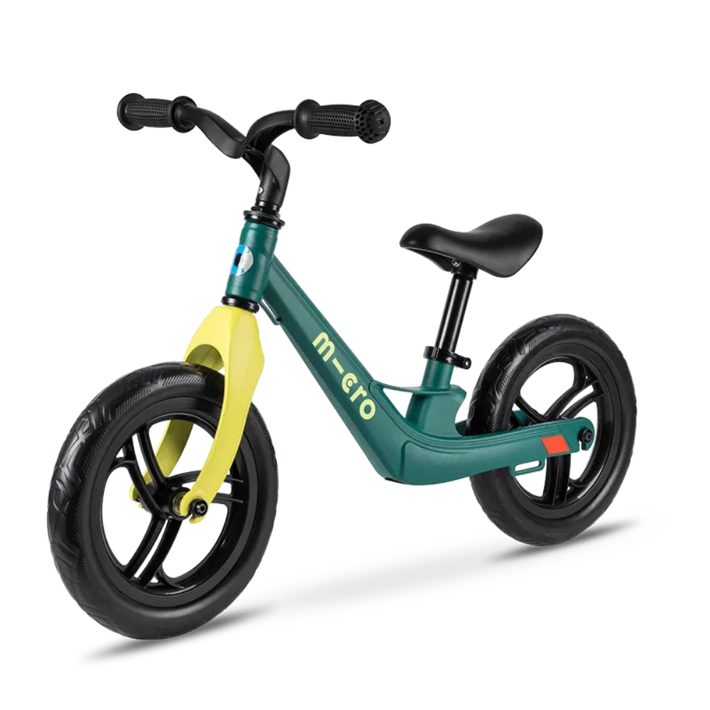 Green and yellow balance bike with 'm-ero' branding on a white background